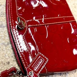 Embossed Logo Patent Leather Turn Lock Wristlet